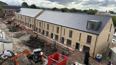 an elevated view looking down at a row of new houses at Silk Street in Newton Heath