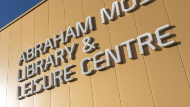 Image of the Abraham Moss Library and Leisure Centre sign.