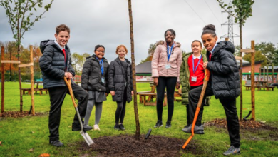 Children planting trees at St Willibrord’s RC Primary School in Clayton