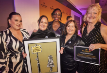 The Be Proud awards 2023 overall winners - Mero’s World Foundation with their certificate and prize. Image credit to Mark Waugh.
