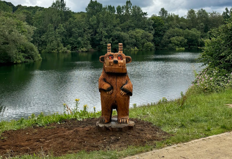 A wood sculpture of a Gruffalo