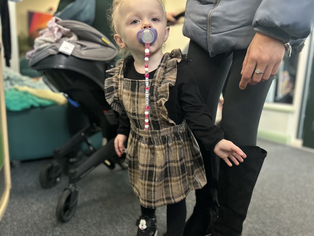 Twenty-month-old Mia-Victoria Crossley in her stylish dress from Our Community Wardrobe 