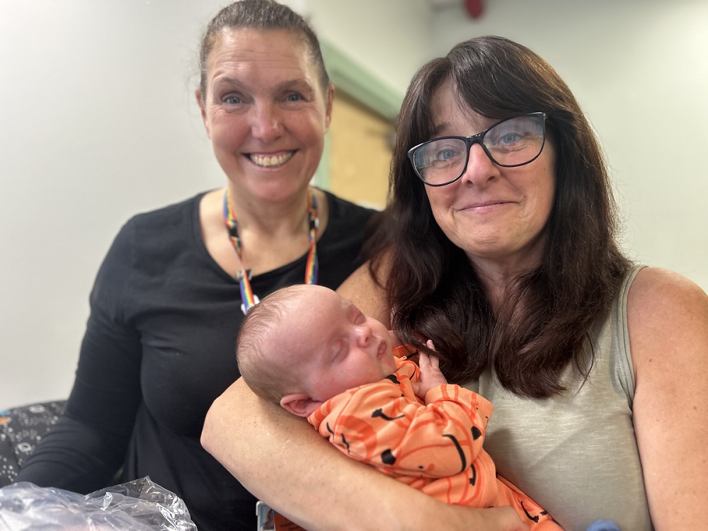 Parenting Officer Joanna Bird and Sally Maher of Our Community Wardrobe with baby Parker