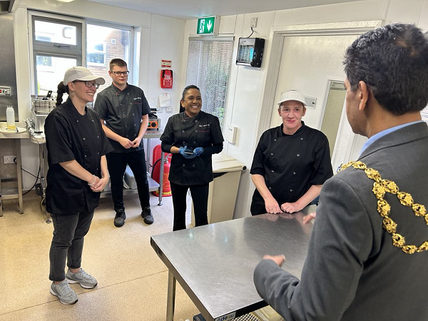 Mayor of Oldham meets team at Anna's Community Cafe including Jodie (left) Tyler and Anna (middle) and Fran (right).