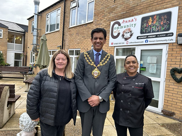 Mayor of Oldham outside anna s Community Kitchen with Anna Kennedy of wifi north west right and susan delaney of Housing 21 left