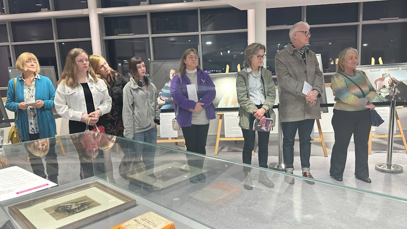 A group of people at the opening of the exhibition