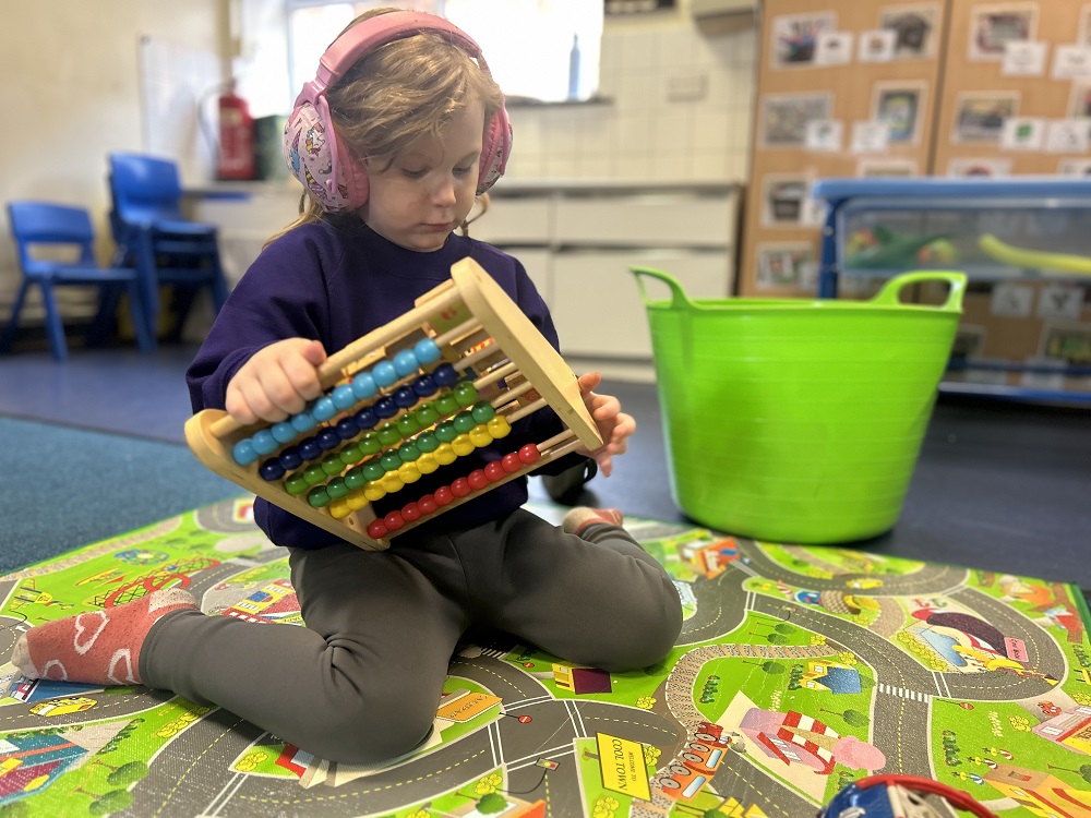 A pupil playing and learning at Richmond Academy