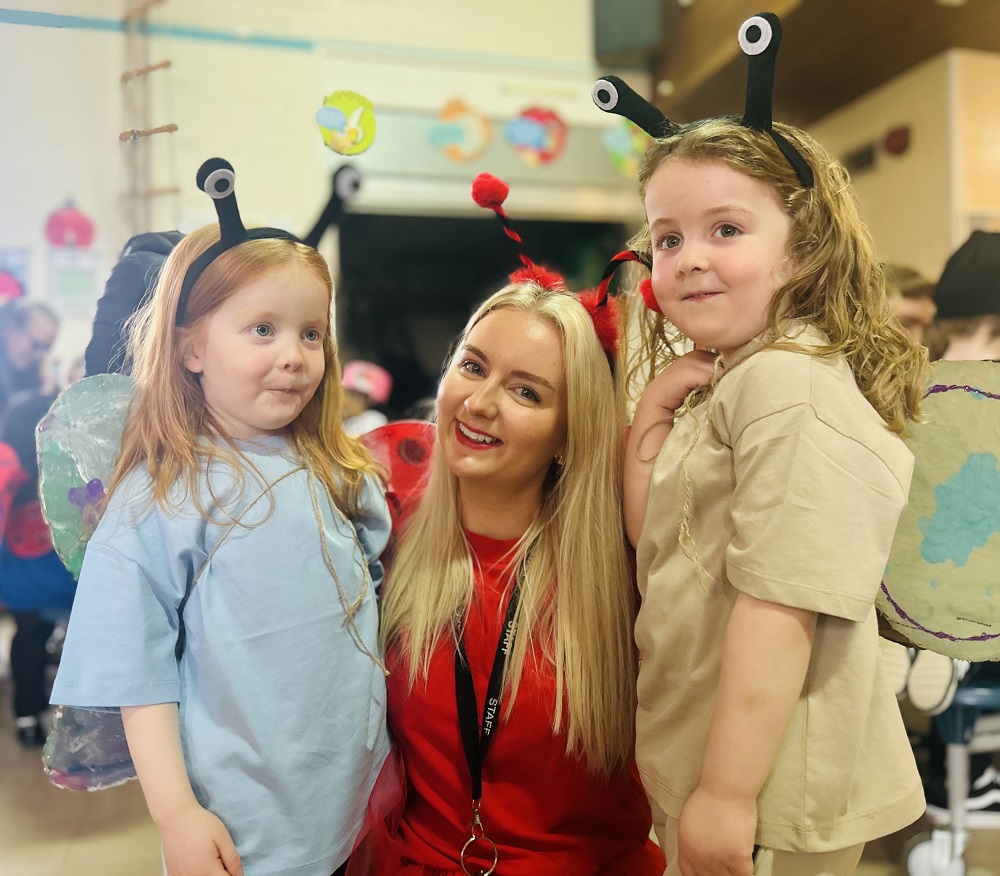 Happy children dressed up as insects 
