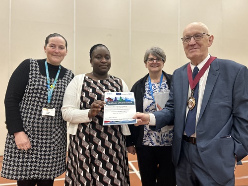 Cheryl Bates, Special Project Lead for Get Oldham Working, NHS Curriculum Delivery Facilitator Sharon Nuttall and the Deputy Mayor of Oldham Cllr Eddie Moores with (centre) Tania Tamba