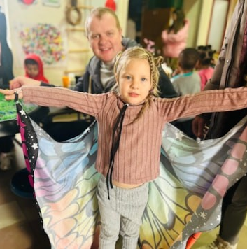 A child wearing a butterfly costume 