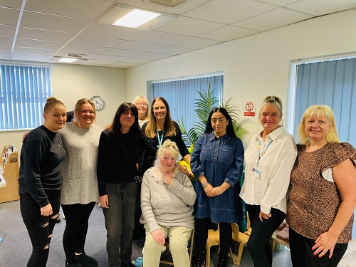 Council Leader Cllr Arooj Shah with the Our Community Wardrobe volunteers and Family Hubs team at Shaw Family Hub
