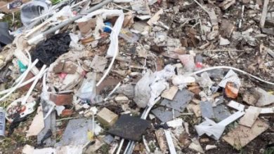 Building boss hit with £1,000 bill after dumping rubbish on open land